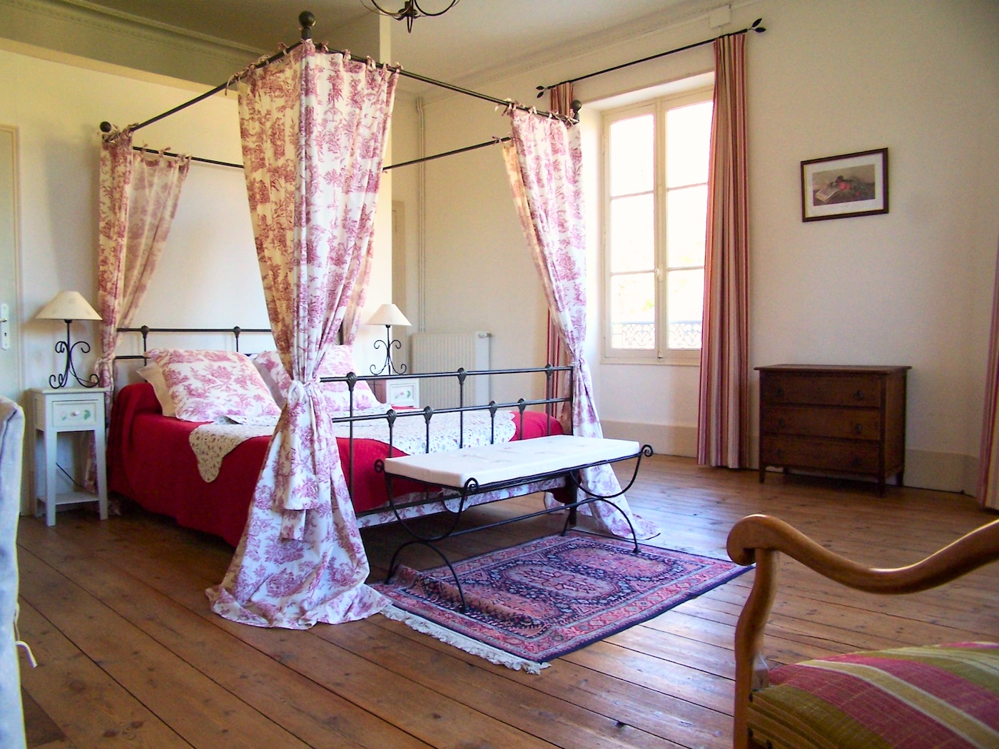 red bed in large room bed & breakfast